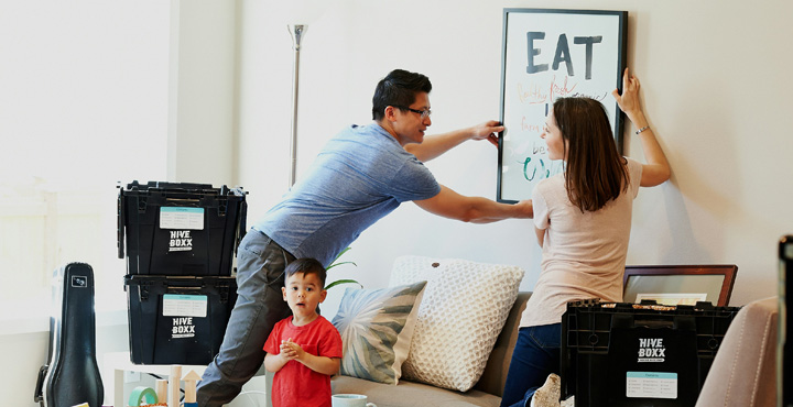 Image of family moving into a house
